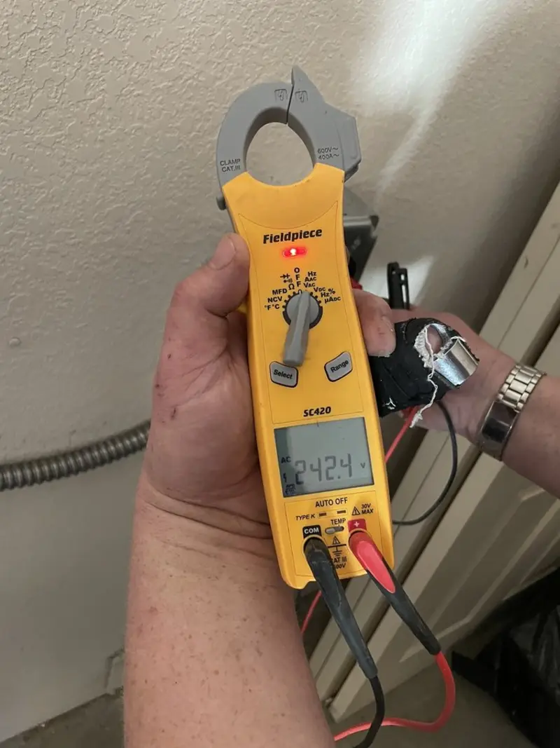 Voltage testing with clamp meter during Electrical Installation Services in Suncrest